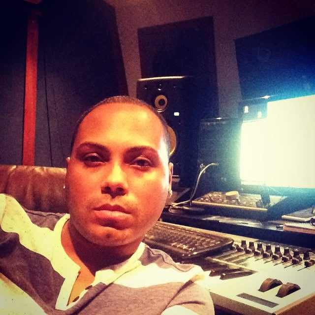 Archival portrait of Klasico at a recording studio mixing desk