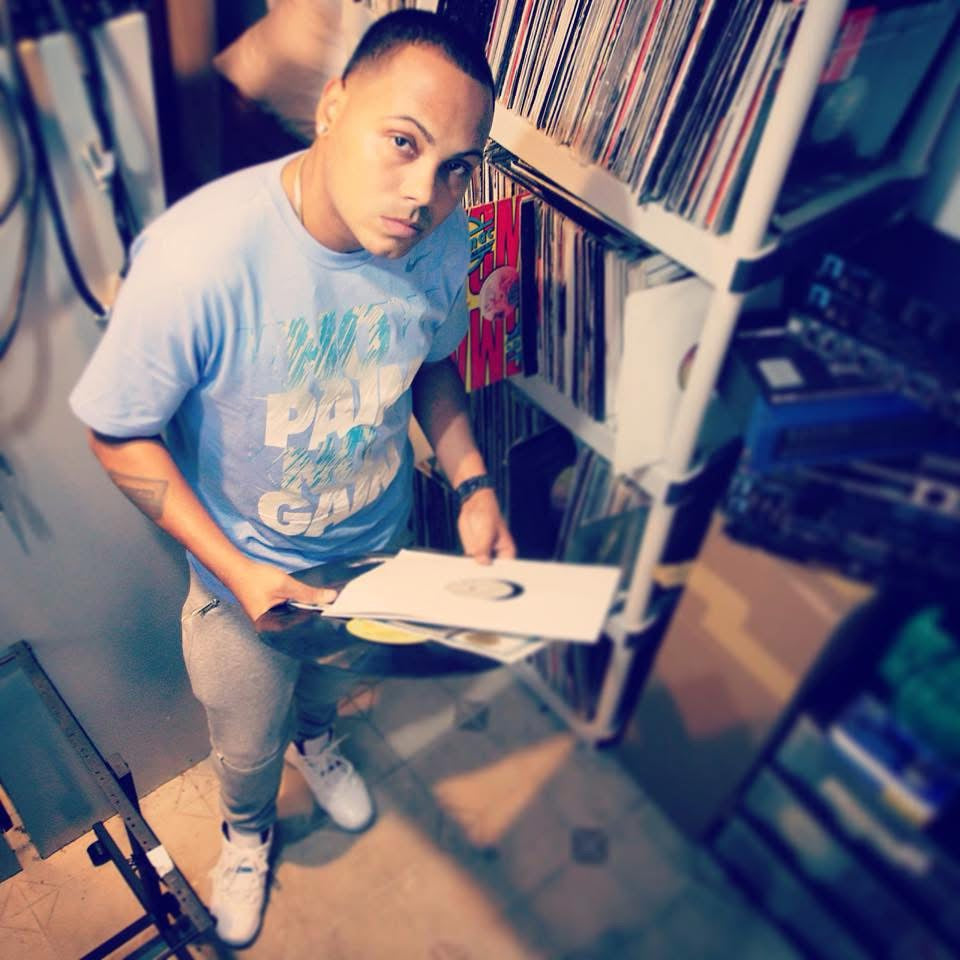 Archival photo of Klasico browsing vinyl records
